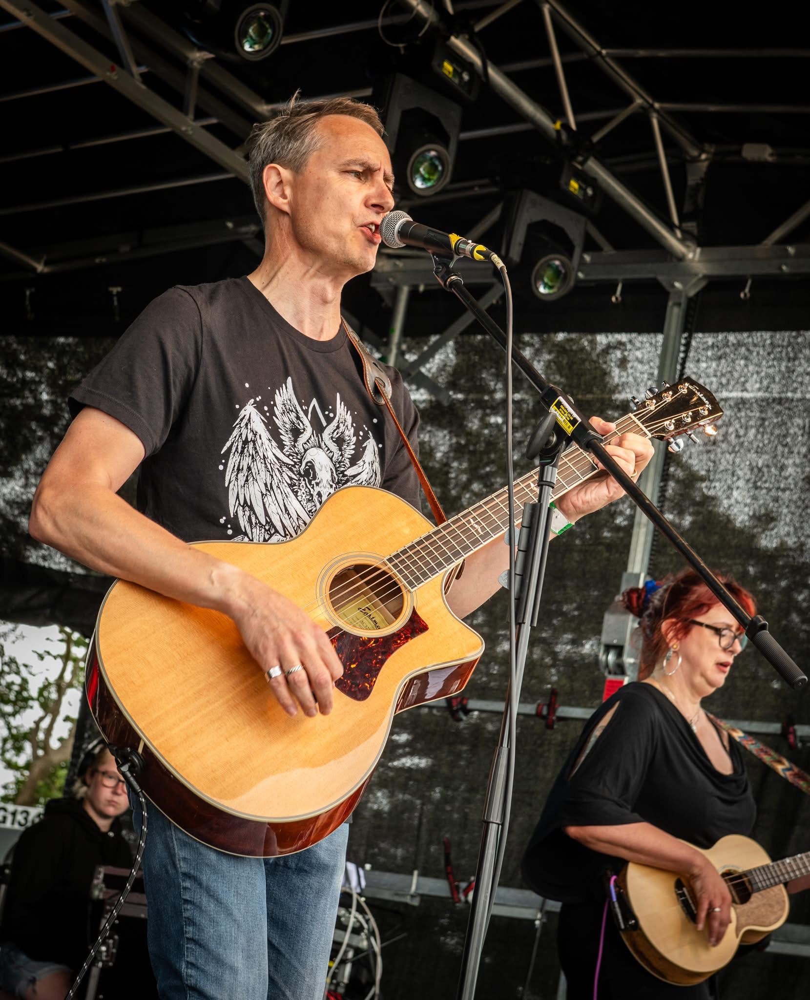 Two guitarists performing live at Woo Fest 2025