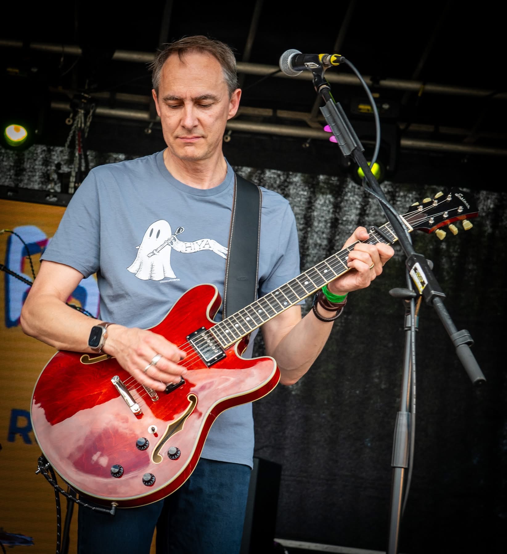 Electric guitarist playing a red guitar at Woo Fest 2026